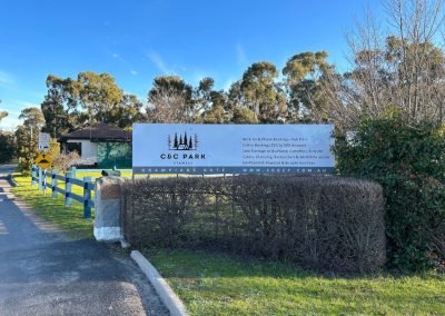 Entrance signage of C&C Park in Stawell, showcasing various accommodation options such as cabins, glamping, and work-time stays, set amidst lush greenery, indicating the park's proximity to Grampians Gate and inviting guests for a serene getaway at Stawell Hotel Motel Accommodation