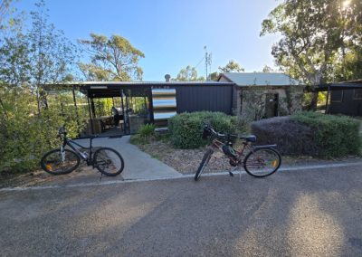 Bicycles parked outside a modern amenities building surrounded by greenery at Stawell Hotel Motel Accommodation